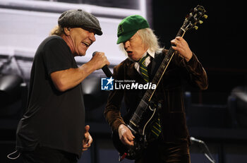 2024-05-25 - Australian heavy metal and rock ’n roll legend band Ac/Dc (guitarist Angus Young and singer Brian Johnson) performing on stage during their “Pwr/up Tour at RCF Arena in Reggio Emilia, Italy, May 25, 2024 - photo Michele Nucci - AC/DC PWR UP TOUR - CONCERTS - MUSIC BAND