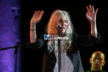 2024-09-03 - Patti Smith during the live Pasolini and Sea at Teatro Antico Ostia Antica on September 3, 2024 in Rome, Italy - PATTI SMITH - PASOLINI AND SEA - CONCERTS - SINGER AND ARTIST