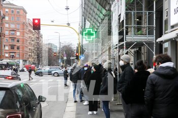 2021-12-24 - Queue at pharmacy to purchase rapid test pads for covid-19. The new wave with the Omicron variant increased infections under the Christmas holiday - QUEUE AT PHARMACY TO PURCHASE RAPID TEST PADS FOR COVID-19. - NEWS - HEALTH