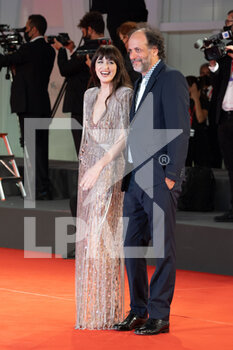 2021-09-03 - Dakota Johnson and Luca Guadagnino attend the red carpet of the movie 