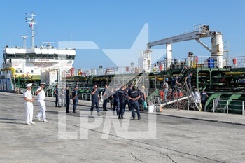 2022-08-16 - Port authority members of Monopoli (Italy), board on the Ukrainian ship Mustafa Necati for checks. The ship, left from Odessa harbour, contains 6000 tons of sunflower oil - UCRANIAN SHIP WITH SUNFLOWER OIL ARRIVES IN ITALY - NEWS - CHRONICLE