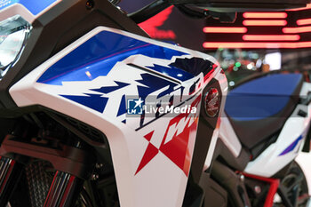 2023-11-07 - Logo of Honda Africa Twin on-off motorcycle exposed at 80th edition of EICMA - Milan International Exhibition of Cycle and Motorcycle at Rho Fair on November 7, 2023, Rho - Milan, Italy. - EICMA - 80TH EDITION OF INTERNATIONAL CYCLE AND MOTORCYCLE EXHIBITION - NEWS - EVENTS