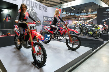 2023-11-07 - Honda motocross bike exposed ad NILS Stand at 80th edition of EICMA - Milan International Exhibition of Cycle and Motorcycle at Rho Fair on November 7, 2023, Rho - Milan, Italy. - EICMA - 80TH EDITION OF INTERNATIONAL CYCLE AND MOTORCYCLE EXHIBITION - NEWS - EVENTS