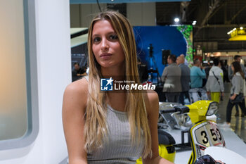 2023-11-07 - Model at Lambretta stand at 80th edition of EICMA - Milan International Exhibition of Cycle and Motorcycle at Rho Fair on November 7, 2023, Rho - Milan, Italy. - EICMA - 80TH EDITION OF INTERNATIONAL CYCLE AND MOTORCYCLE EXHIBITION - NEWS - EVENTS