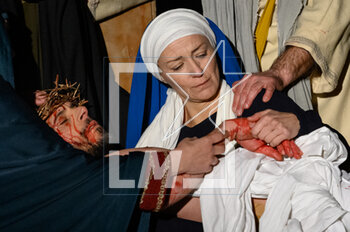 2023-04-07 - Mary embraces her son after his death - RITES OF GOOD FRIDAY GOOD FRIDAY RITES 