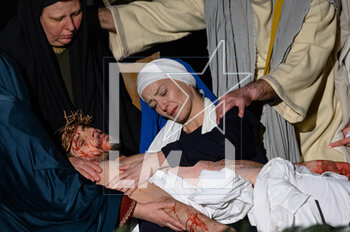 2023-04-07 - Mary embraces her son after his death - RITES OF GOOD FRIDAY GOOD FRIDAY RITES 