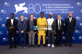 2023-09-06 - Mamadou Kouassi, Paolo Del Brocco, Matteo Garrone, Seydou Sarr, Moustapha Fall, producers Joseph Rouschop and Ardavan Safaee attend a photocall for 