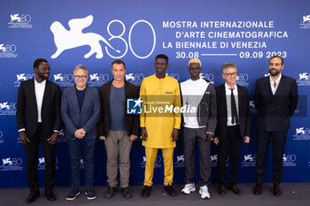2023-09-06 - Mamadou Kouassi, Paolo Del Brocco, Matteo Garrone, Seydou Sarr, Moustapha Fall, producers Joseph Rouschop and Ardavan Safaee attend a photocall for 