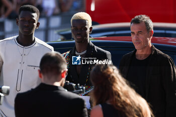 2023-09-06 - Seydou Sarr, Moustapha Fall and Matteo Garrone attend a red carpet for the movie 