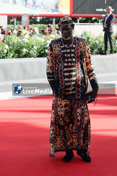 2023-09-06 - A guest attends a red carpet for the movie 