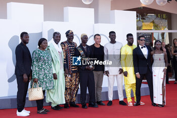 2023-09-06 - Mamadou Kouassi, guest, Issaka Sawagodo, guest, Moustapha Fall, Matteo Garrone, Seydou Sarr, guest, Hichem Yacoubi and Flaure B.B. Kabore attend a red carpet for the movie 