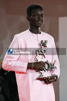 2023-09-09 - Seydou Sarr poses with the Marcello Mastroianni Award for Best New Young Actor or Actress for ‘Io Capitano’ at the winner's photocall at the 80th Venice International Film Festival on September 09, 2023 in Venice, Italy. ©Photo: Cinzia Camela. - WINNERS PHOTOCALL - THE 80TH VENICE INTERNATIONAL FILM FESTIVAL - NEWS - VIP