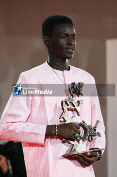 2023-09-09 - Seydou Sarr poses with the Marcello Mastroianni Award for Best New Young Actor or Actress for ‘Io Capitano’ at the winner's photocall at the 80th Venice International Film Festival on September 09, 2023 in Venice, Italy. ©Photo: Cinzia Camela. - WINNERS PHOTOCALL - THE 80TH VENICE INTERNATIONAL FILM FESTIVAL - NEWS - VIP