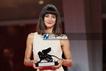 2023-09-09 - Katia Khazak poses with the Horizons Best Actor Award on the name of Tergel Bold-Erdene for 'City of Wind' at the winner's photocall at the 80th Venice International Film Festival on September 09, 2023 in Venice, Italy. ©Photo: Cinzia Camela. - WINNERS PHOTOCALL - THE 80TH VENICE INTERNATIONAL FILM FESTIVAL - NEWS - VIP