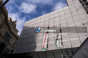 2024-03-13 - Activists from the Naples Network for Palestine and the Naples Student Network for Palestine and Handala Ali Cultural Centre symbolically occupied the scaffolding on the facade of the San Carlo theatre in Naples, lowering two banners to promote the demonstration on Friday 15 March at 2.30 p.m. in Piazza Garibaldi to stop the genocide in Palestine and to demand the release of Anan Yaeesh from prison in Terni. - ACTIVISTS PRO PALESTINE IN NAPLES - NEWS - CHRONICLE
