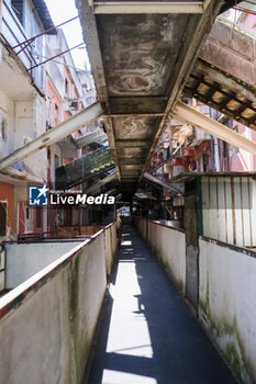 2024-09-11 - The interior of the Red Sail in Scampia, one of the two sails affected by the eviction decree. The mayor of Naples Gaetano Manfredi has signed two ordinances for the 'ad horas' eviction of the Vela Gialla and Vela Rossa in Scampia, the two buildings scheduled for demolition. The orders were signed 'for safety reasons' and 'because of the risks threatening public and private safety'. The two buildings are owned by the City of Naples and currently occupied, located in the Scampia district in Via della Resistenza, block C - Vela Gialla and block D - Vela Rossa. - VELE OF SCAMPIA, MAYOR MANFREDI ORDERS URGENT EVICTION - NEWS - CHRONICLE