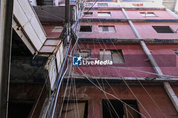 2024-09-11 - The interior of the Red Sail in Scampia, one of the two sails affected by the eviction decree. The mayor of Naples Gaetano Manfredi has signed two ordinances for the 'ad horas' eviction of the Vela Gialla and Vela Rossa in Scampia, the two buildings scheduled for demolition. The orders were signed 'for safety reasons' and 'because of the risks threatening public and private safety'. The two buildings are owned by the City of Naples and currently occupied, located in the Scampia district in Via della Resistenza, block C - Vela Gialla and block D - Vela Rossa. - VELE OF SCAMPIA, MAYOR MANFREDI ORDERS URGENT EVICTION - NEWS - CHRONICLE