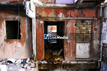 2024-09-11 - The interior of the Red Sail in Scampia, one of the two sails affected by the eviction decree. The mayor of Naples Gaetano Manfredi has signed two ordinances for the 'ad horas' eviction of the Vela Gialla and Vela Rossa in Scampia, the two buildings scheduled for demolition. The orders were signed 'for safety reasons' and 'because of the risks threatening public and private safety'. The two buildings are owned by the City of Naples and currently occupied, located in the Scampia district in Via della Resistenza, block C - Vela Gialla and block D - Vela Rossa. - VELE OF SCAMPIA, MAYOR MANFREDI ORDERS URGENT EVICTION - NEWS - CHRONICLE