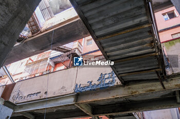 2024-09-11 - The interior of the Red Sail in Scampia, one of the two sails affected by the eviction decree. The mayor of Naples Gaetano Manfredi has signed two ordinances for the 'ad horas' eviction of the Vela Gialla and Vela Rossa in Scampia, the two buildings scheduled for demolition. The orders were signed 'for safety reasons' and 'because of the risks threatening public and private safety'. The two buildings are owned by the City of Naples and currently occupied, located in the Scampia district in Via della Resistenza, block C - Vela Gialla and block D - Vela Rossa. - VELE OF SCAMPIA, MAYOR MANFREDI ORDERS URGENT EVICTION - NEWS - CHRONICLE