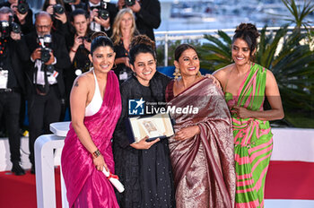2024-05-25 - Kani Kusruti, Chhaya Kadam, Payal Kapadia and Divya Prabha pose with the Grand Prix Award for 'All We Imagine As Light' at the Palme D'Or Winners Photocall at the 77th annual Cannes Film Festival at Palais des Festivals on May 25, 2024 in Cannes, France. - PALME D'OR WINNERS PHOTOCALL - THE 77TH ANNUAL CANNES FILM FESTIVAL - NEWS - CULTURE