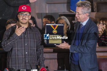 2024-02-12 - Geolier at the Maschio Angioino in Naples, where Mayor Gaetano Manfredi presented the singer with a personalised plaque to celebrate his extraordinary achievement at the 2024 Sanremo Festival. - GEOLIER RECEIVES PLAQUE FROM THE MAYOR OF NAPLES  - NEWS - EVENTS