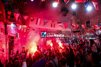 2024-10-30 - Today for Neapolitans is Diego Armando Maradona's birthday Naples. Fans tribute to Diego Armando Maradona by lighting smoke bombs and chanting chants under the mural in the Spanish quarters, if diego would still be alive today he would have celebrated his 64nd birthday. - NAPLES CELEBRATES MARADONA'S 64TH BIRTHDAY - NEWS - EVENTS