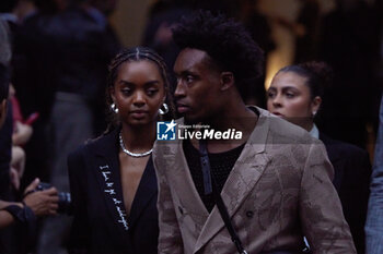 2024-06-15 - Collin Sexton and a guest leaves the Emporio Armani fashion show during the Milan Menswear Spring/Summer 2025 on June 15, 2024 in Milan, Italy. ©Photo: Cinzia Camela. - EMPORIO ARMANI - MILAN FASHION WEEK - MENSWEAR SS 25 - CELEBRITIES - NEWS - FASHION