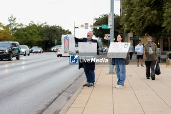 2024-11-05 - Supporters of Democratic candidate for U.S. Senate Collin Allred hold signs against incumbent Ted Cruz (R-TX) outside the polling place at City Hall. - VOTING DAY - UNITED STATES PRESIDENTIAL ELECTION IN TEXAS - NEWS - POLITICS