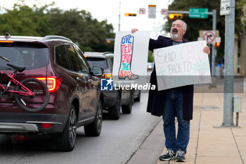 2024-11-05 - A supporter of Democratic candidate for U.S. Senate Collin Allred hold signs against incumbent Ted Cruz (R-TX) outside the polling place at 4 City Hall. - VOTING DAY - UNITED STATES PRESIDENTIAL ELECTION IN TEXAS - NEWS - POLITICS