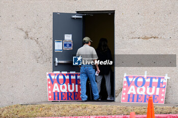 2024-11-05 - Voters wait in line outside the polling place at a public library. Voters in the Texas Capital were met with short lines at most polling places across the metropolitan area, as more than 9 million Texans took advantage of the state’s ease of early voting ahead of Election Day. - VOTING DAY - UNITED STATES PRESIDENTIAL ELECTION IN TEXAS - NEWS - POLITICS