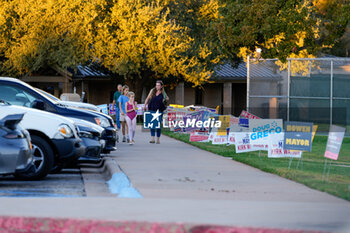 2024-11-05 - A voter and her children leave a polling place in the final hours of voting in the US General Election. Voters across the state capital area were met with short lines at most polling places throughout the day, as more than 9 million Texans cast their ballot during the early voting period. - VOTING DAY - UNITED STATES PRESIDENTIAL ELECTION IN TEXAS - NEWS - POLITICS