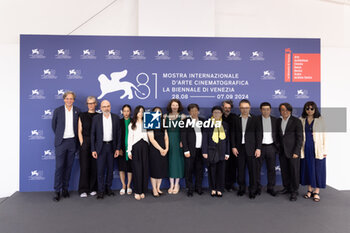 2024-09-06 - (L-R) Guests, Denis Vaslin, Nicolas R. De La Mothe, Sonia Buchman, Director Wang Bing, Vincent Wang, Gilles Chanial and guest attend the 