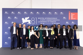 2024-09-06 - (L-R) Guests, Denis Vaslin, Nicolas R. De La Mothe, Sonia Buchman, Director Wang Bing, Vincent Wang, Gilles Chanial and guest attend the 