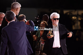 2024-09-07 - Pedro Almodovar poses with the golden Lion Award for The room next door