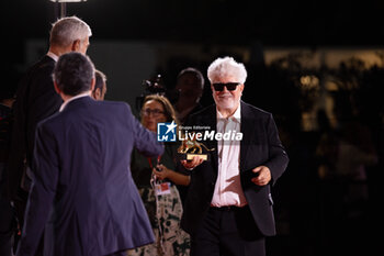 2024-09-07 - Pedro Almodovar poses with the golden Lion Award for The room next door