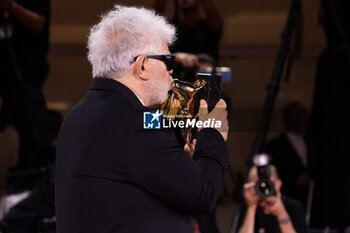 2024-09-07 - Pedro Almodovar poses with the golden Lion Award for The room next door