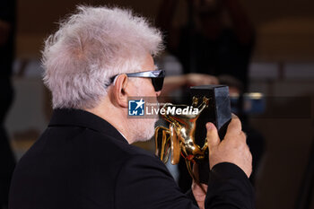 2024-09-07 - Pedro Almodovar poses with the golden Lion Award for The room next door