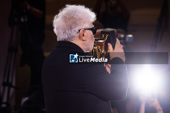 2024-09-07 - Pedro Almodovar poses with the golden Lion Award for The room next door