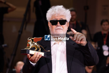 2024-09-07 - Pedro Almodovar poses with the golden Lion Award for The room next door