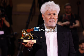 2024-09-07 - Pedro Almodovar poses with the golden Lion Award for The room next door