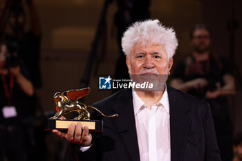 2024-09-07 - Pedro Almodovar poses with the golden Lion Award for The room next door