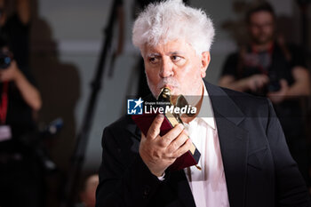 2024-09-07 - Pedro Almodovar poses with the golden Lion Award for The room next door