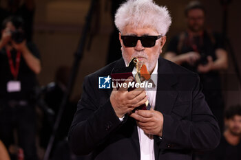 2024-09-07 - Pedro Almodovar poses with the golden Lion Award for The room next door