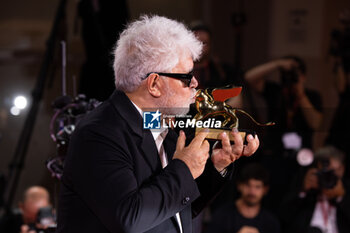 2024-09-07 - Pedro Almodovar poses with the golden Lion Award for The room next door