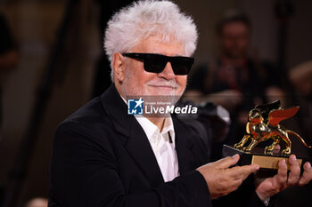 2024-09-07 - Pedro Almodovar poses with the golden Lion Award for The room next door