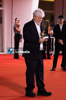 2024-09-07 - Pedro Almodovar poses with the golden Lion Award for The room next door