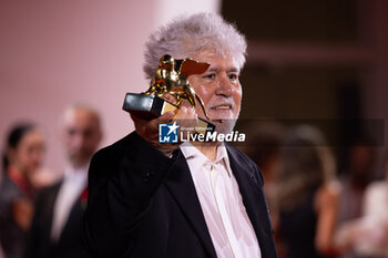 2024-09-07 - Pedro Almodovar poses with the golden Lion Award for The room next door