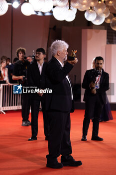 2024-09-07 - Pedro Almodovar poses with the golden Lion Award for The room next door