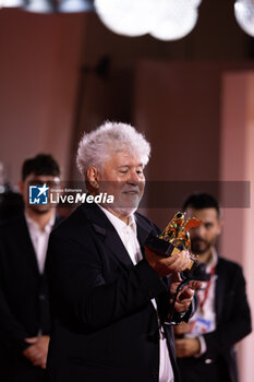 2024-09-07 - Pedro Almodovar poses with the golden Lion Award for The room next door