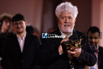 2024-09-07 - Pedro Almodovar poses with the golden Lion Award for The room next door